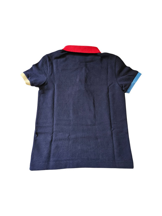 A Navy Short Sleeve Polos from Lacoste in size 6T for neutral. (Back View)