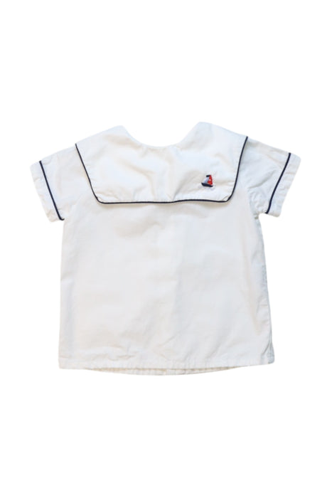 A White Short Sleeve Shirts from Kidiwi in size 3-6M for girl. (Front View)