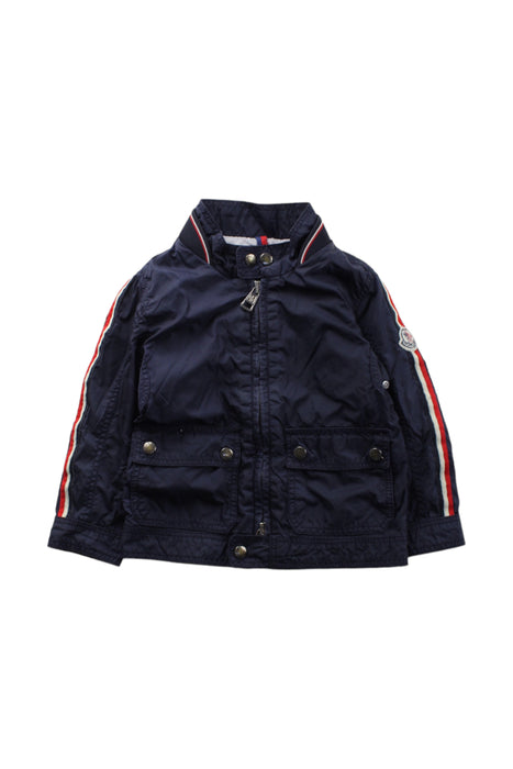 A Blue Lightweight Jackets from Moncler in size 12-18M for boy. (Front View)