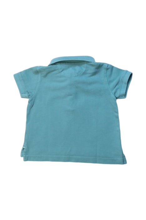 A Blue Short Sleeve Polos from Nanos in size 6-12M for boy. (Back View)