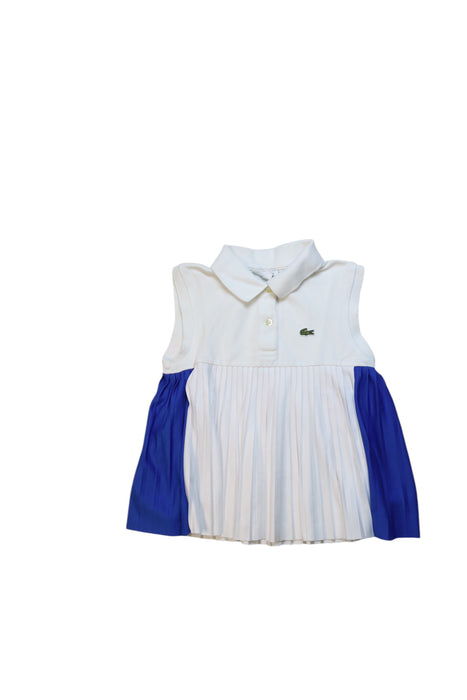 A White Sleeveless Polos from Lacoste in size 6T for girl. (Front View)