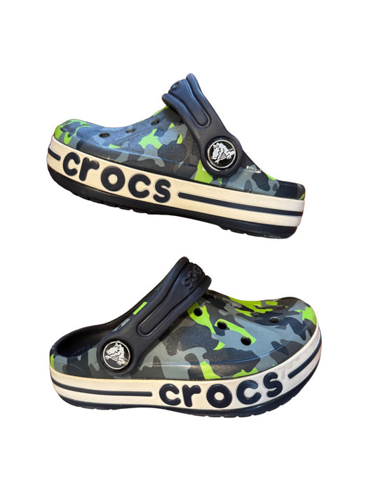 A Green Slip Ons from Crocs in size 18-24M for boy. (Back View)