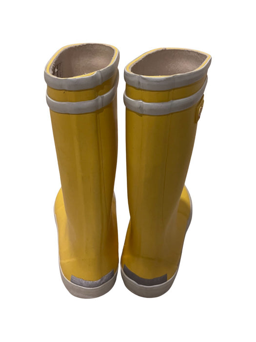 A Yellow Rain Boots from Aigle in size 6T for neutral. (Back View)