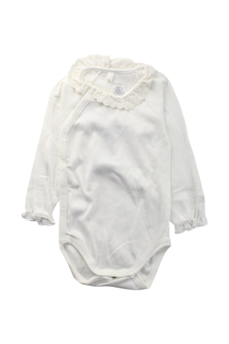 A White Long Sleeve Bodysuits from Petit Bateau in size 6-12M for neutral. (Front View)