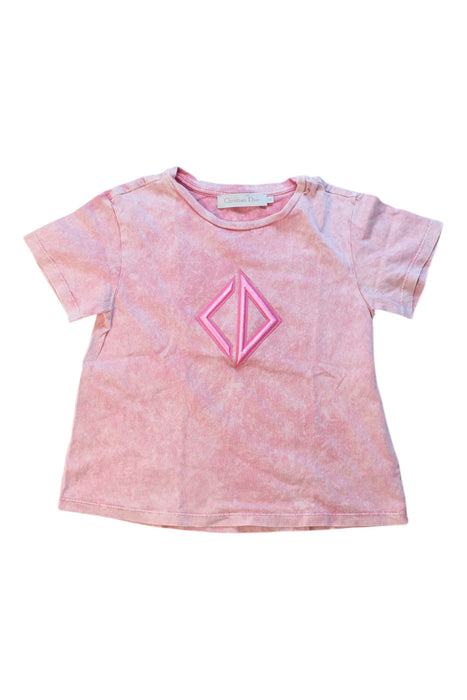 A Pink Short Sleeve T Shirts from Dior in size 4T for girl. (Front View)