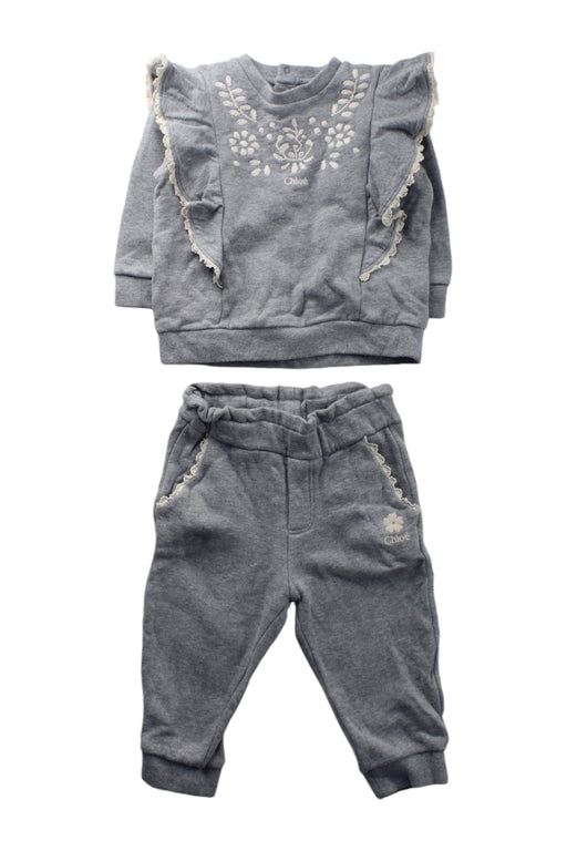 A Grey Pants Sets from Chloe in size 6-12M for girl. (Front View)