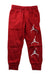 A Red Sweatpants from Nike in size 6T for boy. (Front View)