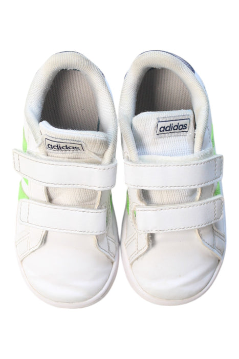 A White Sneakers from Adidas in size 4T for boy. (Back View)