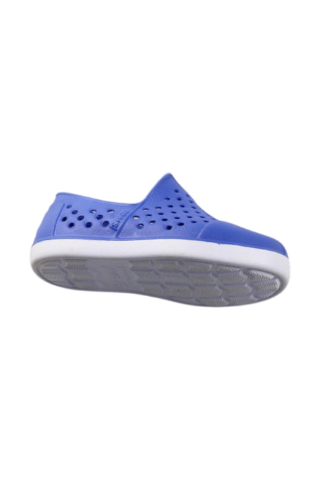A Blue Slip Ons from Toms in size 18-24M for neutral. (Front View)