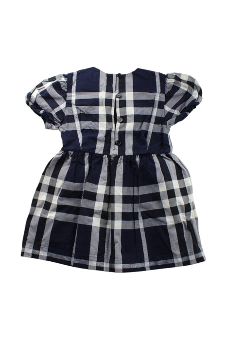 A Navy Short Sleeve Dresses from Burberry in size 4T for girl. (Back View)