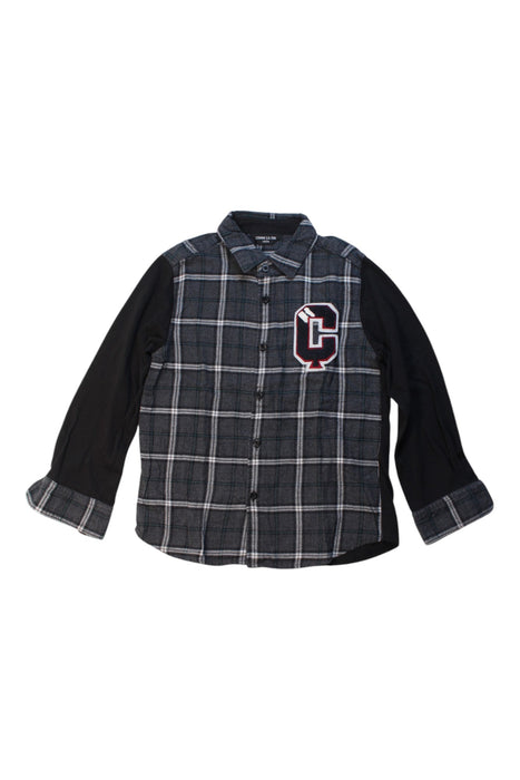 A Black Long Sleeve Shirts from Comme Ca Ism in size 6T for boy. (Front View)