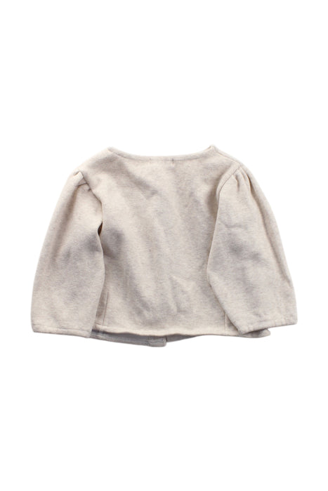 A Ivory Cardigans from Aosta in size 12-18M for neutral. (Back View)