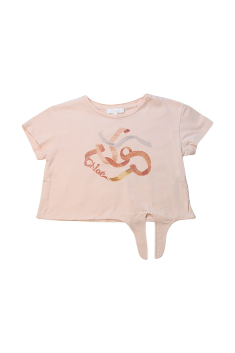 A Peach Short Sleeve Tops from Chloe in size 5T for girl. (Front View)