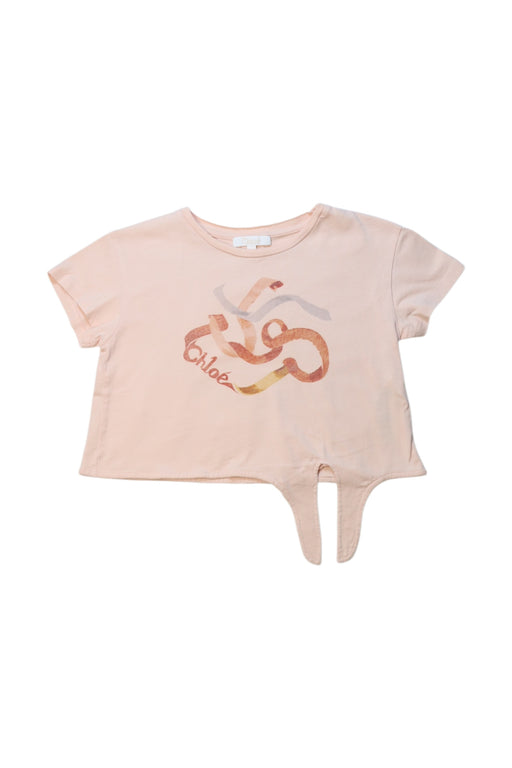A Peach Short Sleeve Tops from Chloe in size 5T for girl. (Front View)