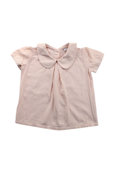 A Peach Short Sleeve Tops from Niny Mini in size 2T for girl. (Front View)