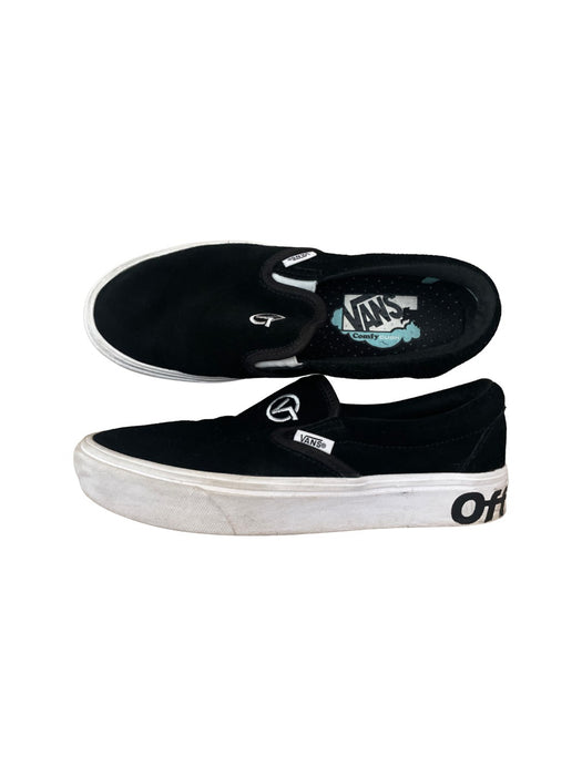 A Black Slip Ons from Vans in size 11Y for neutral. (Front View)