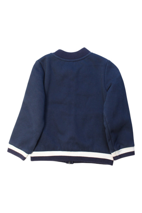A Navy Lightweight Jackets from Jacadi in size 4T for boy. (Back View)