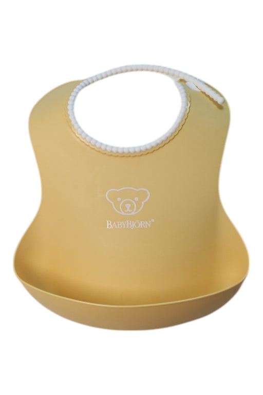 A Yellow Bibs from BabyBjorn in size O/S for neutral. (Front View)