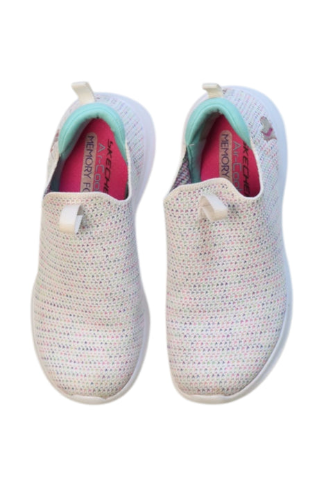 A White Slip Ons from Skechers in size 7Y for neutral. (Back View)
