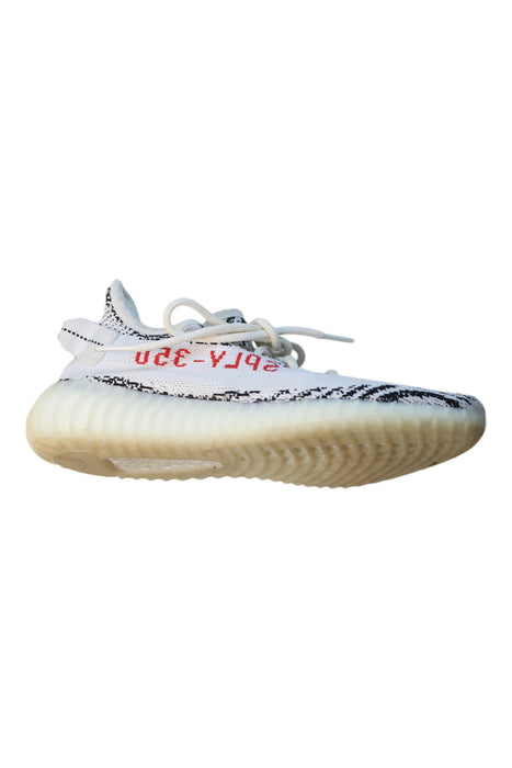 A White Sneakers from Adidas Yeezy in size 14Y for boy. (Front View)
