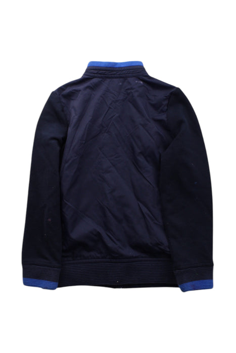 A Navy Lightweight Jackets from Jacadi in size 6T for boy. (Back View)