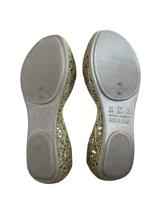 A Gold Flats from Mini Melissa Campana in size 6T for girl. (Back View)