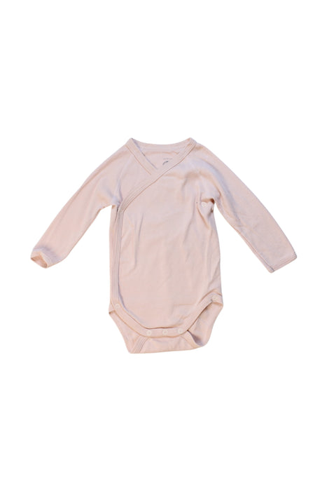 A Peach Long Sleeve Bodysuits from Petit Bateau in size 3-6M for girl. (Front View)
