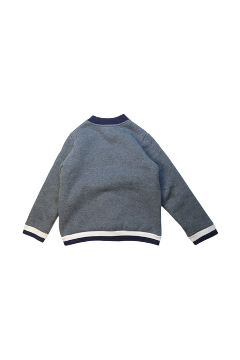 A Grey Lightweight Jackets from Jacadi in size 6T for boy. (Back View)