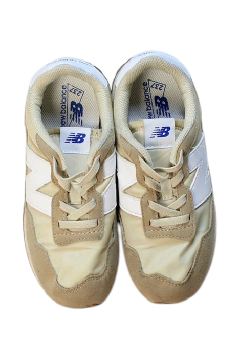 A Beige Sneakers from New Balance in size 10Y for girl. (Back View)