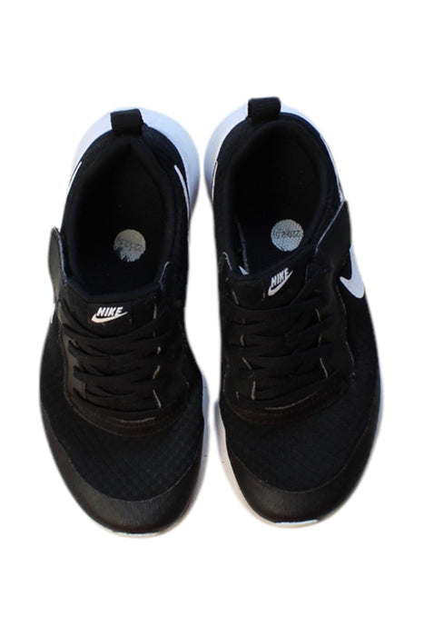 A Black Sneakers from Nike in size 10Y for girl. (Back View)