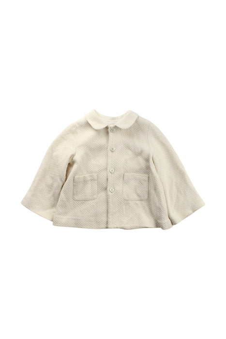 A Ivory Capes & Ponchos from Nanos in size 2T for neutral. (Front View)