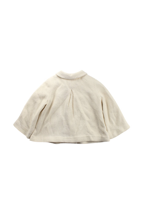 A Ivory Capes & Ponchos from Nanos in size 2T for neutral. (Back View)