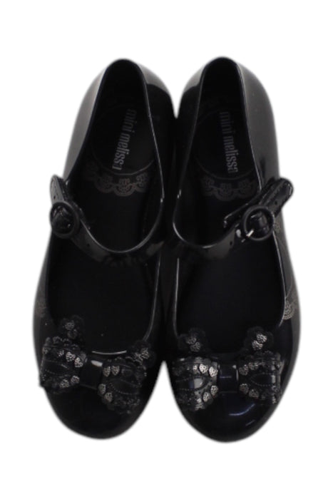 A Black Flats from Mini Melissa in size 6T for girl. (Back View)