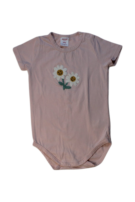 A Peach Short Sleeve Bodysuits from Seed in size 6-12M for girl. (Front View)