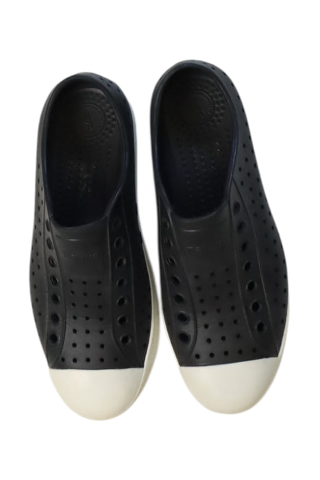 A Black Slip Ons from Native Shoes in size 14Y for neutral. (Back View)