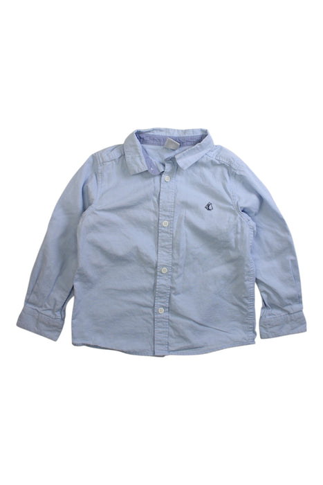 A Blue Long Sleeve Shirts from Petit Bateau in size 4T for boy. (Front View)