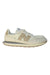 A Beige Sneakers from New Balance in size 7Y for girl. (Front View)