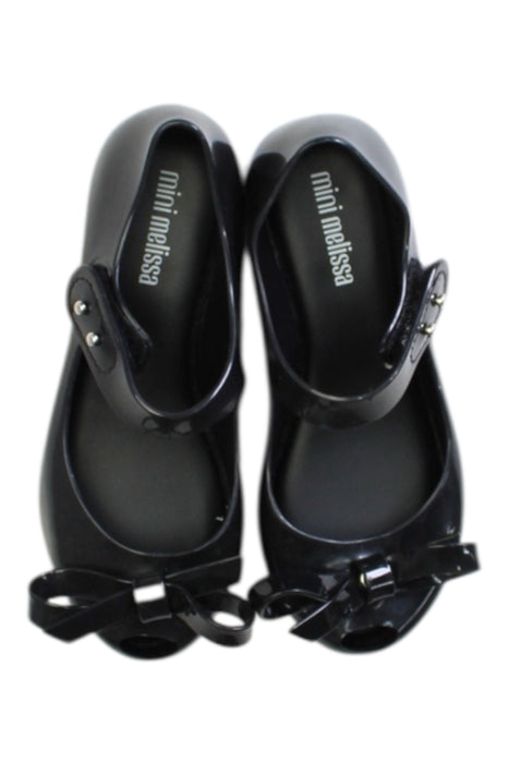A Black Flats from Mini Melissa in size 5T for girl. (Back View)