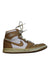A Brown Sneakers from Air Jordan in size 11Y for boy. (Front View)