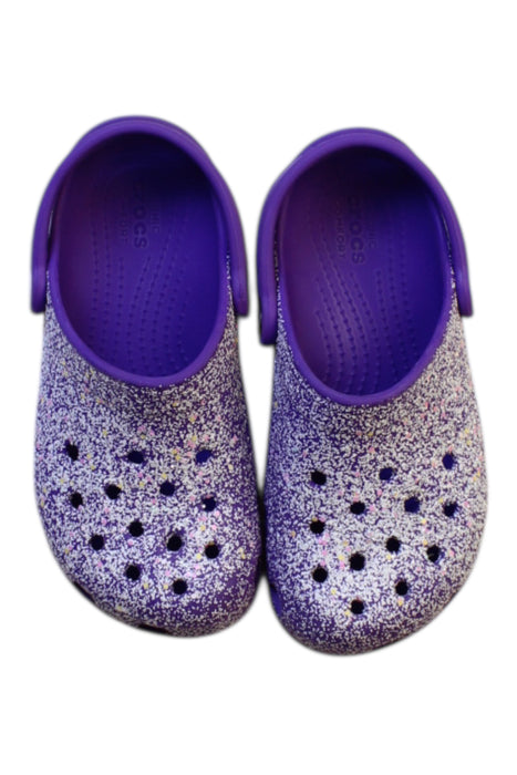 A Purple Slip Ons from Crocs in size 6T for girl. (Back View)