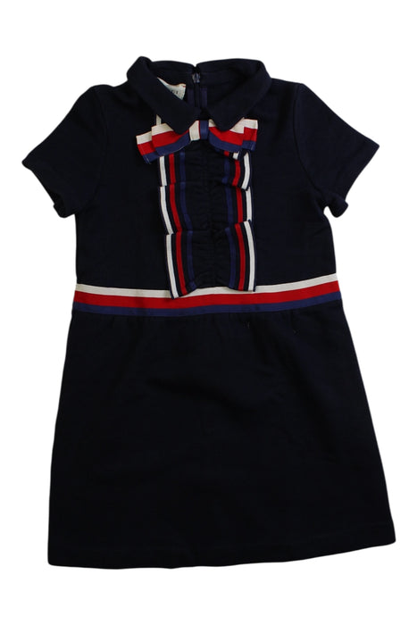 A Navy Short Sleeve Dresses from Gucci in size 5T for girl. (Front View)