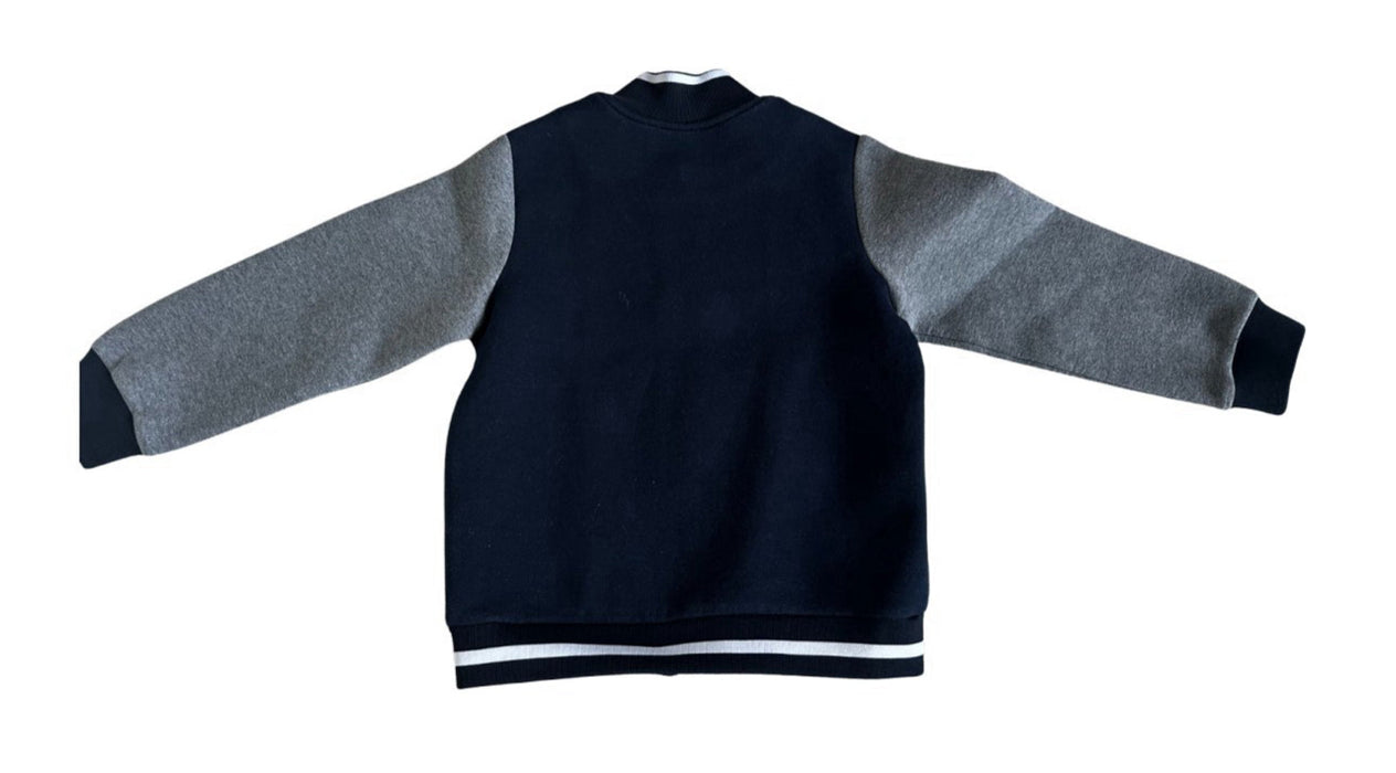 A Navy Lightweight Jackets from Jacadi in size 6T for boy. (Back View)