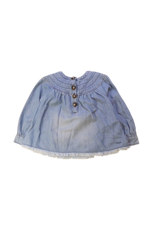 A Blue Long Sleeve Tops from Chloe in size 4T for girl. (Front View)