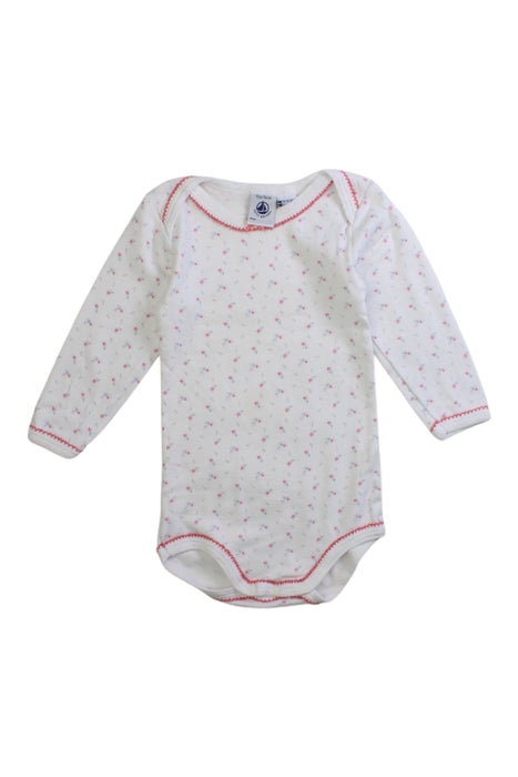 A White Long Sleeve Bodysuits from Petit Bateau in size 6-12M for girl. (Front View)