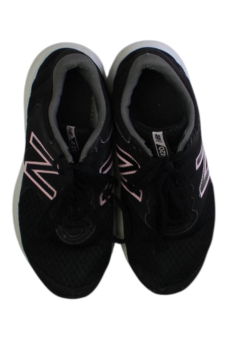 A Black Sneakers from New Balance in size 11Y for girl. (Back View)
