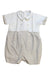 A White Short Sleeve Rompers from Pretty Originals in size 12-18M for boy. (Front View)