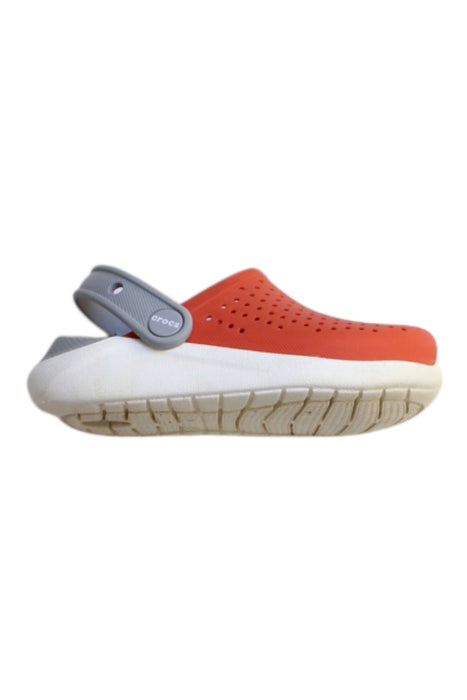 A Orange Slip Ons from Crocs in size 4T for girl. (Front View)
