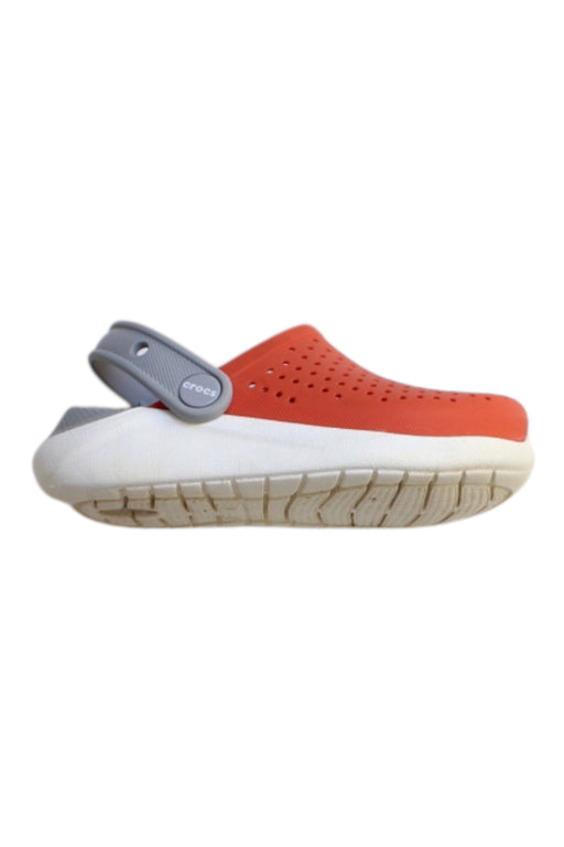A Orange Slip Ons from Crocs in size 4T for girl. (Front View)