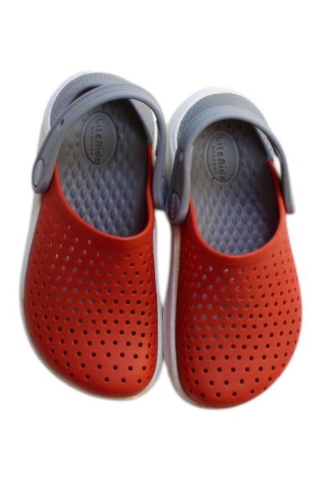 A Orange Slip Ons from Crocs in size 4T for girl. (Back View)