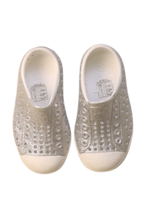 A Silver Slip Ons from Native Shoes in size 18-24M for neutral. (Back View)